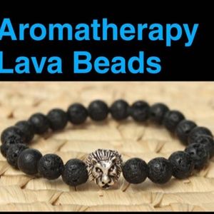 Lion bracelet silver charm and black lava beads.